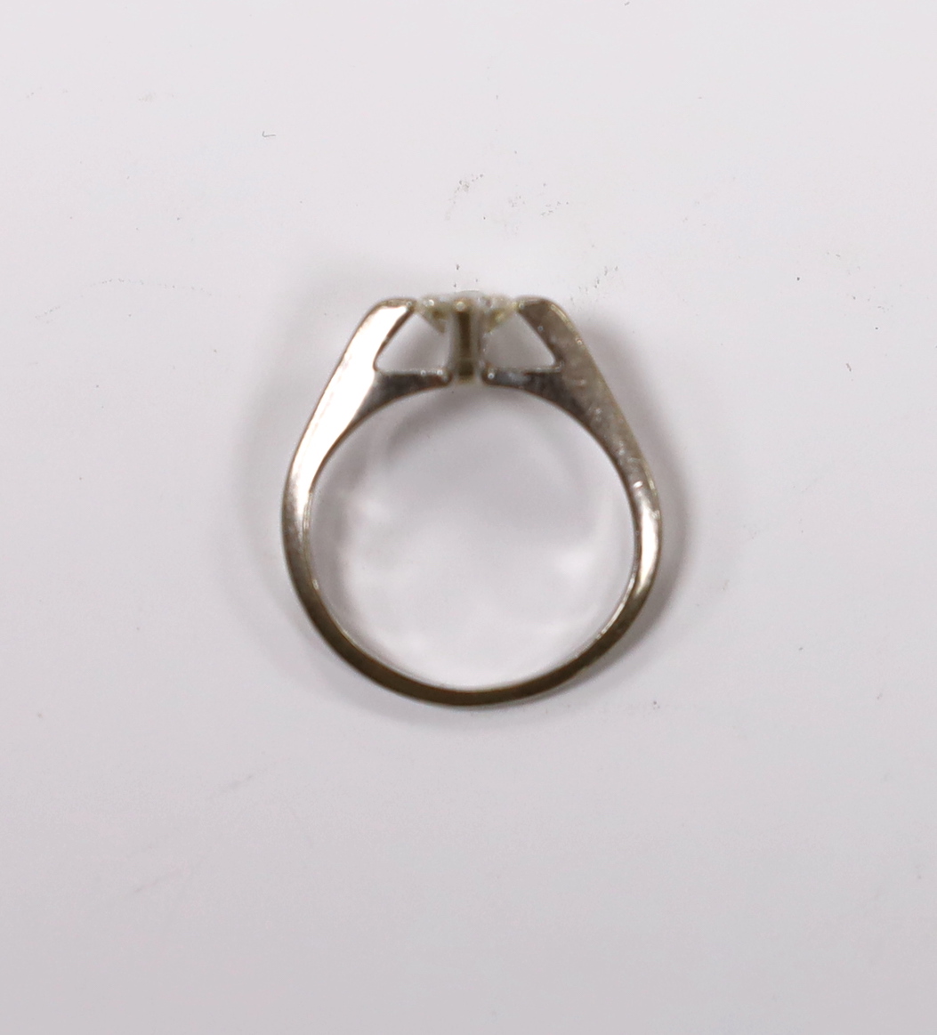 A modern white metal and solitaire diamond set ring, size K, gross weight 3.5 grams.